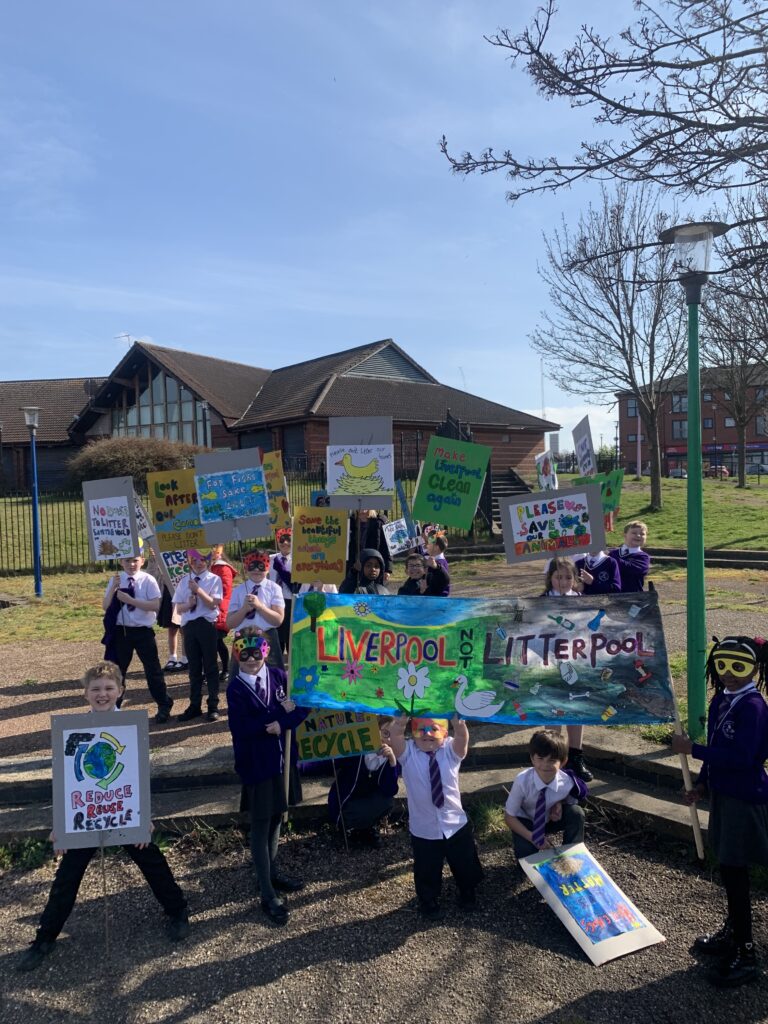The group on their prostest outdoors holding signs